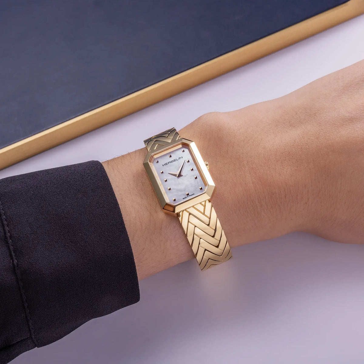 ⁣⁢For the feminine wrist, white mother-of-pearl dial and two-tone steel bracelet visible⁤⁣